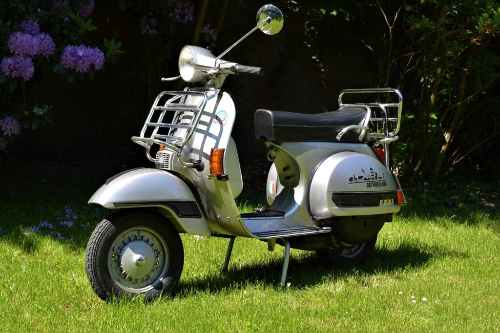 Echange premium vieux scooter Vespa